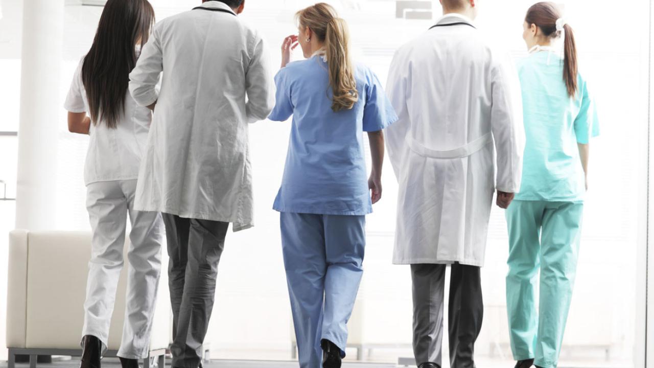 A group of hospital teams, doctors and nurses walking together