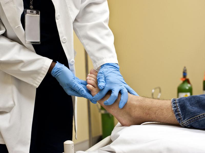 Physician checking a patient's foot