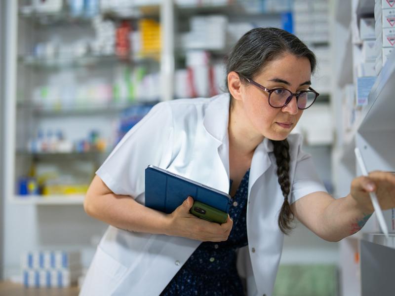 Pharmacist checking the stock of medications