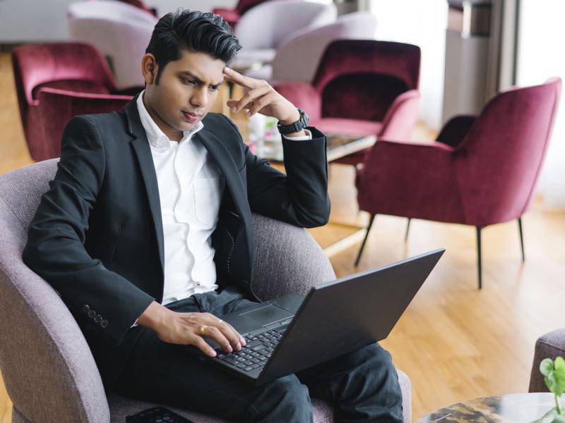 Focused businessperson working on a laptop