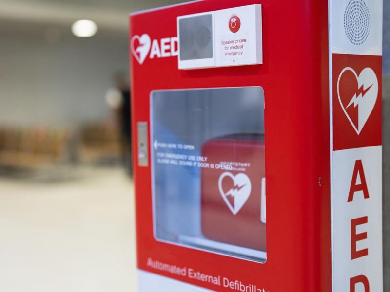 An Automated External Defibrillator, (AED) placed on the wall