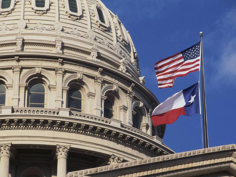 Texas State Capitol dome and flags