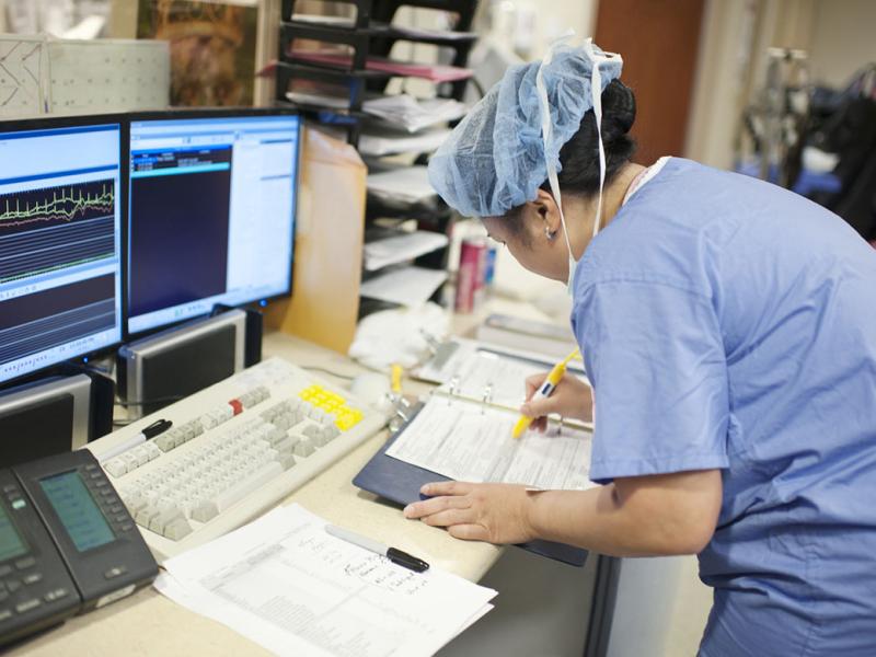 Health care worker prepares paperwork