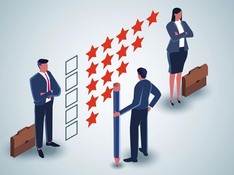 Businesspeople standing by a five-star rating