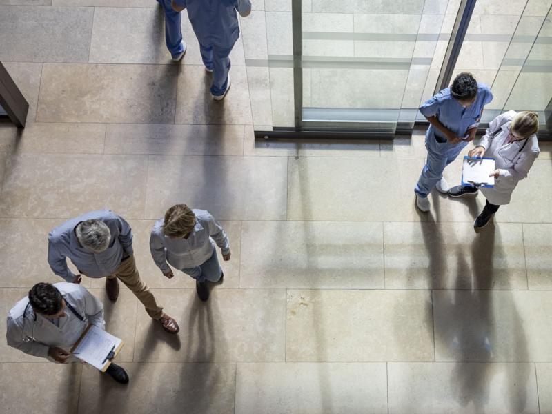 Patients and doctors coming in and out of the hospital