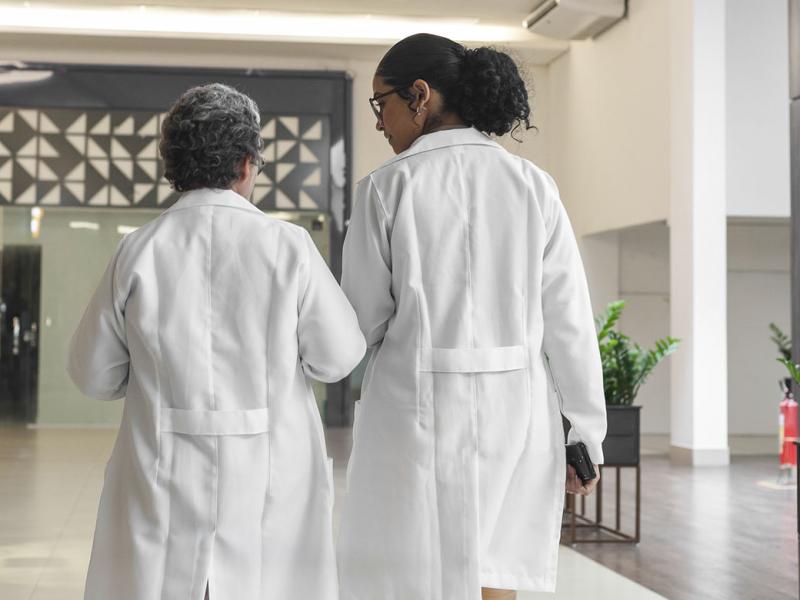 Two doctors talking in a hallway