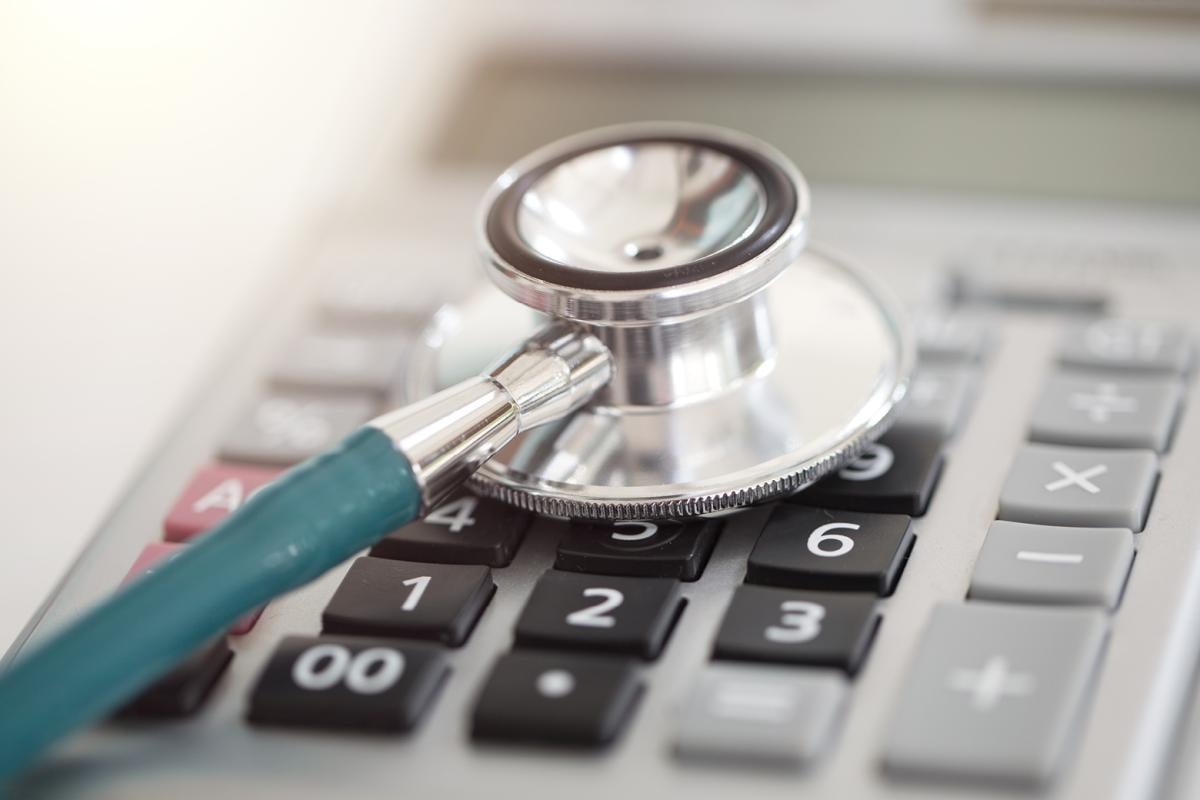 Stethoscope lying on top of calculator