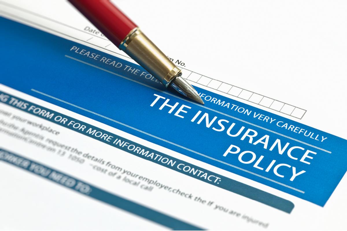 Pen placed on insurance policy form