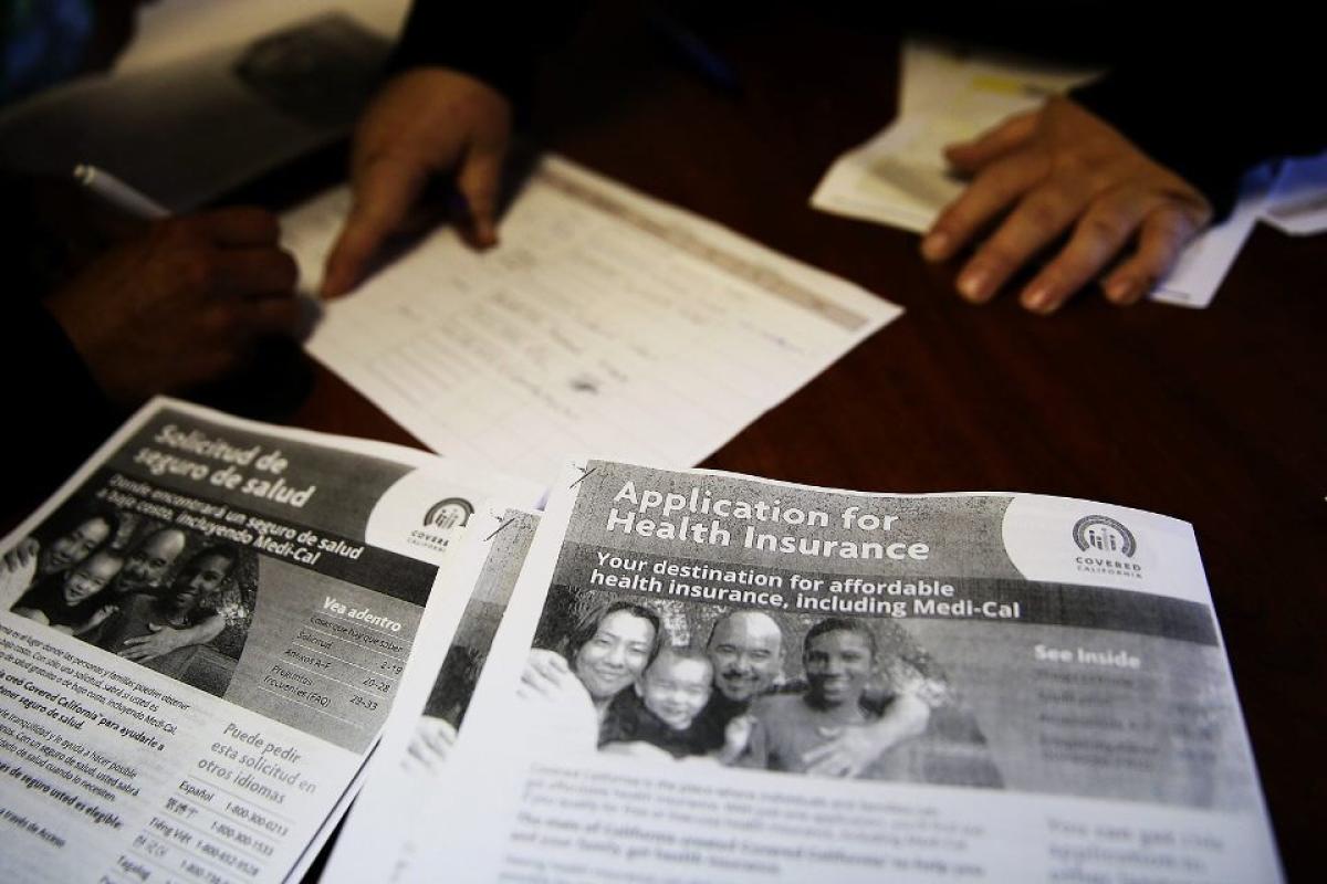 Health insurance signup forms on a desk
