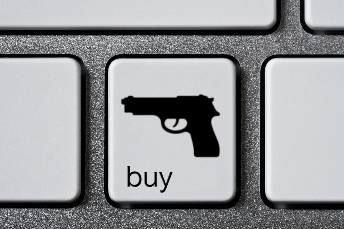 Keyboard button with a gun on it