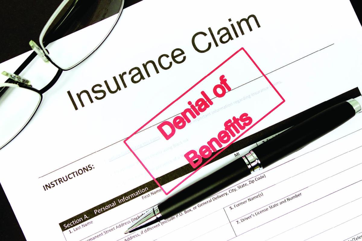 Insurance claim stamped with "Denial of Benefits"