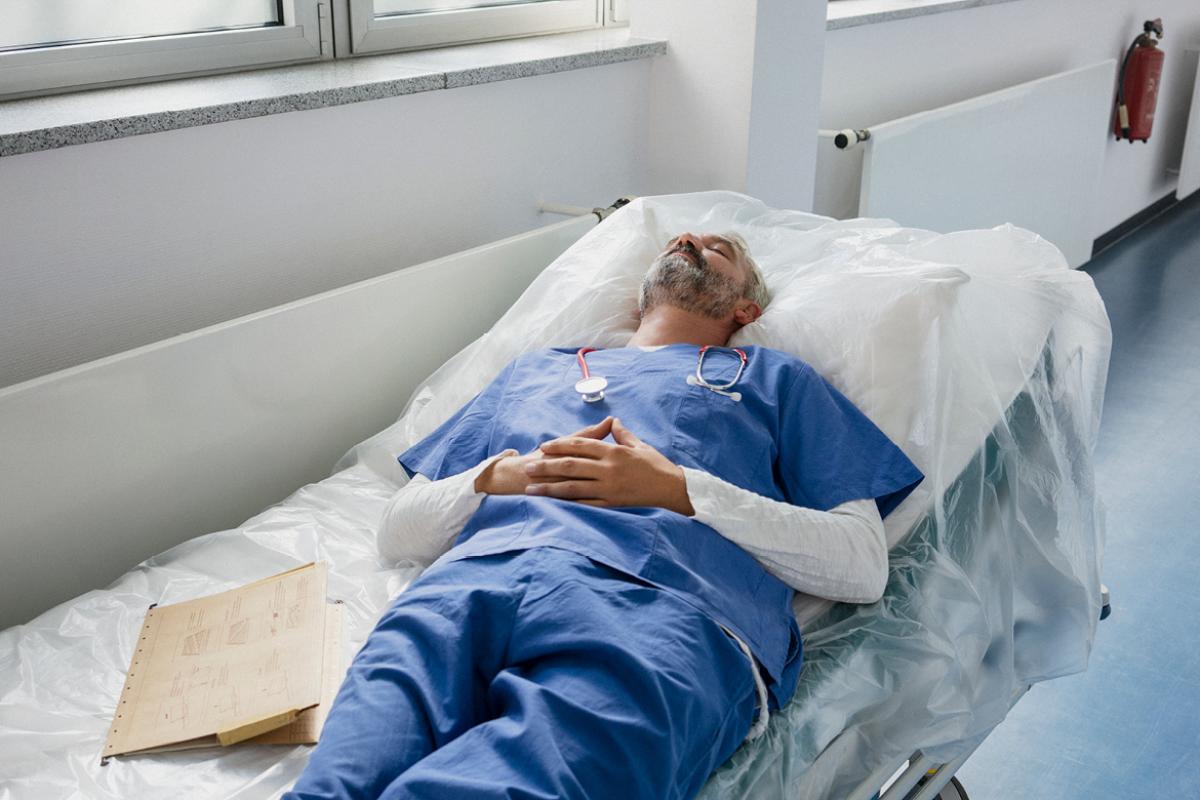 Physician napping on a hospital bed