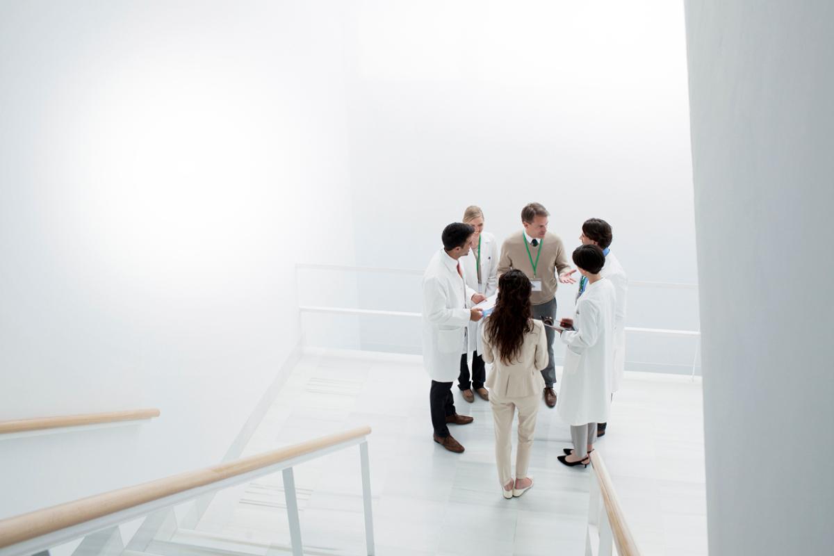 Group of physicians talking in a stairwell