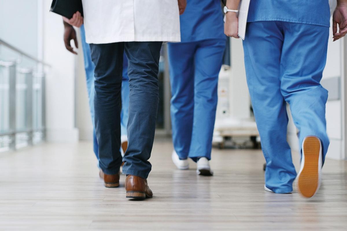 Group of physicians walking down a corridor