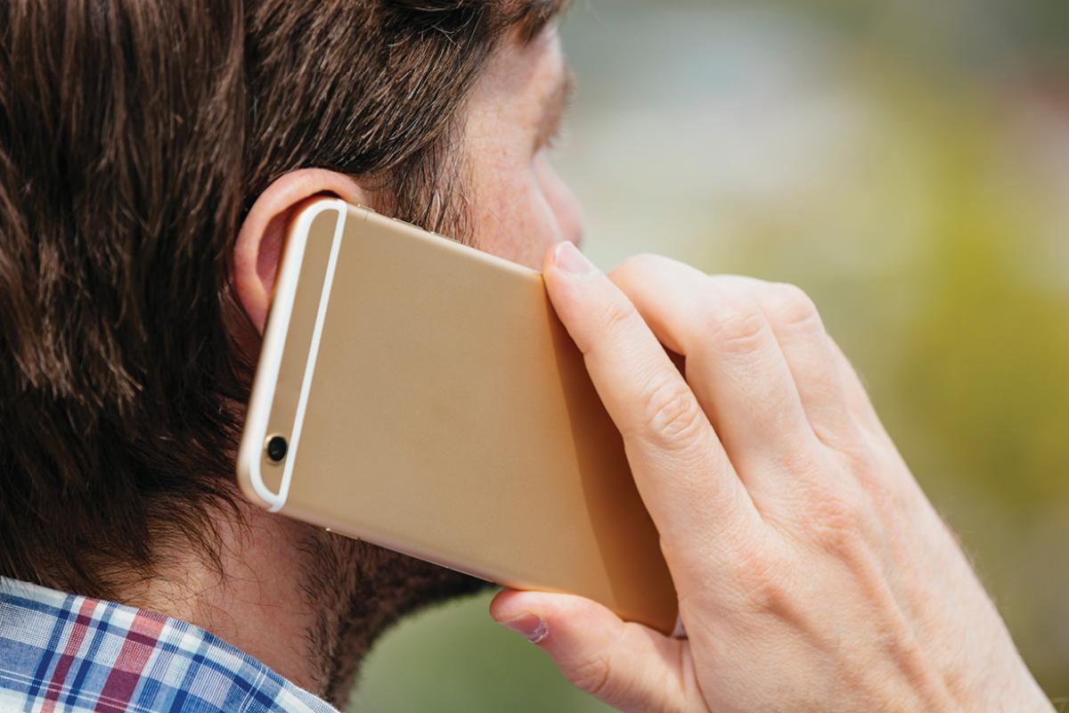 Man with cell phone to his ear