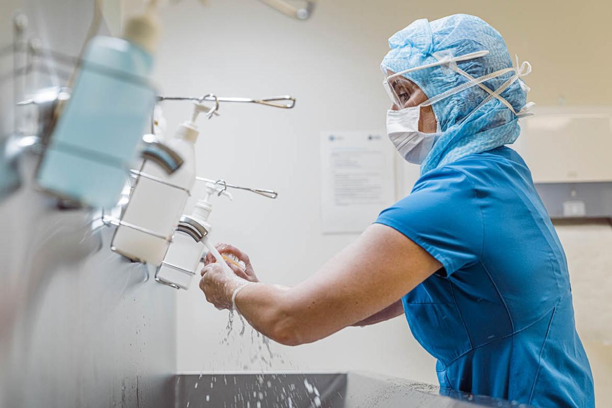 Health care worker washing hands