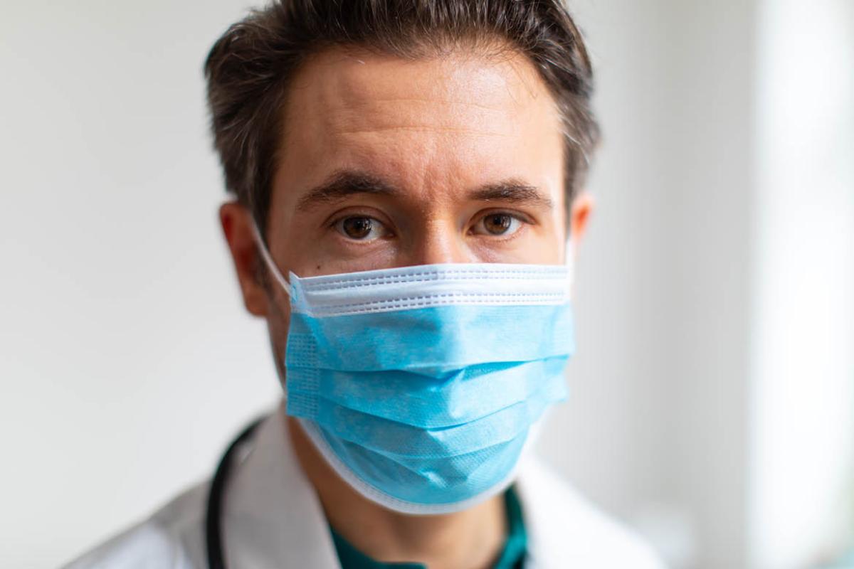 Physician wearing facemask