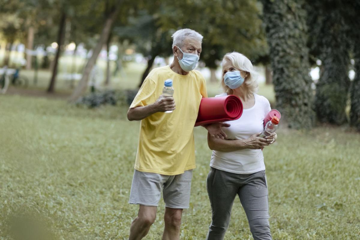 Couple wearing face masks outside