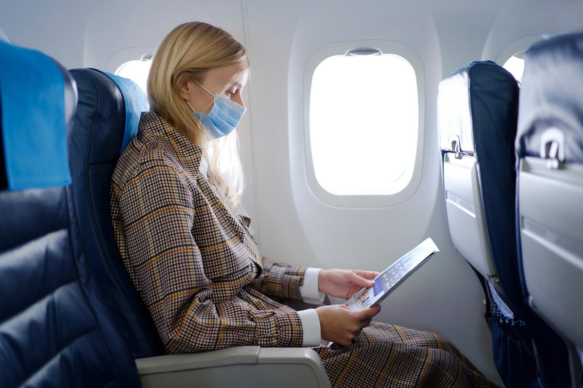 Airplane passenger wearing a face mask