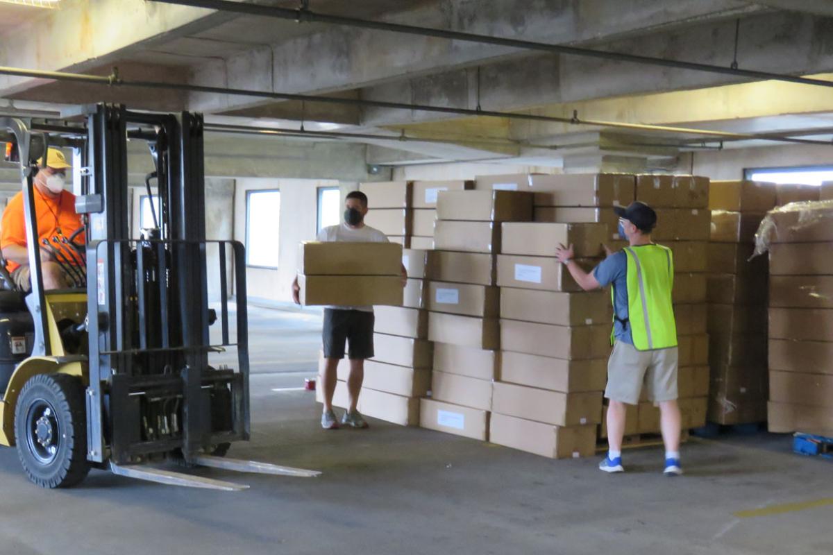 Forklift being used for boxes of N95 masks to be distributed by Texas Medical Association.