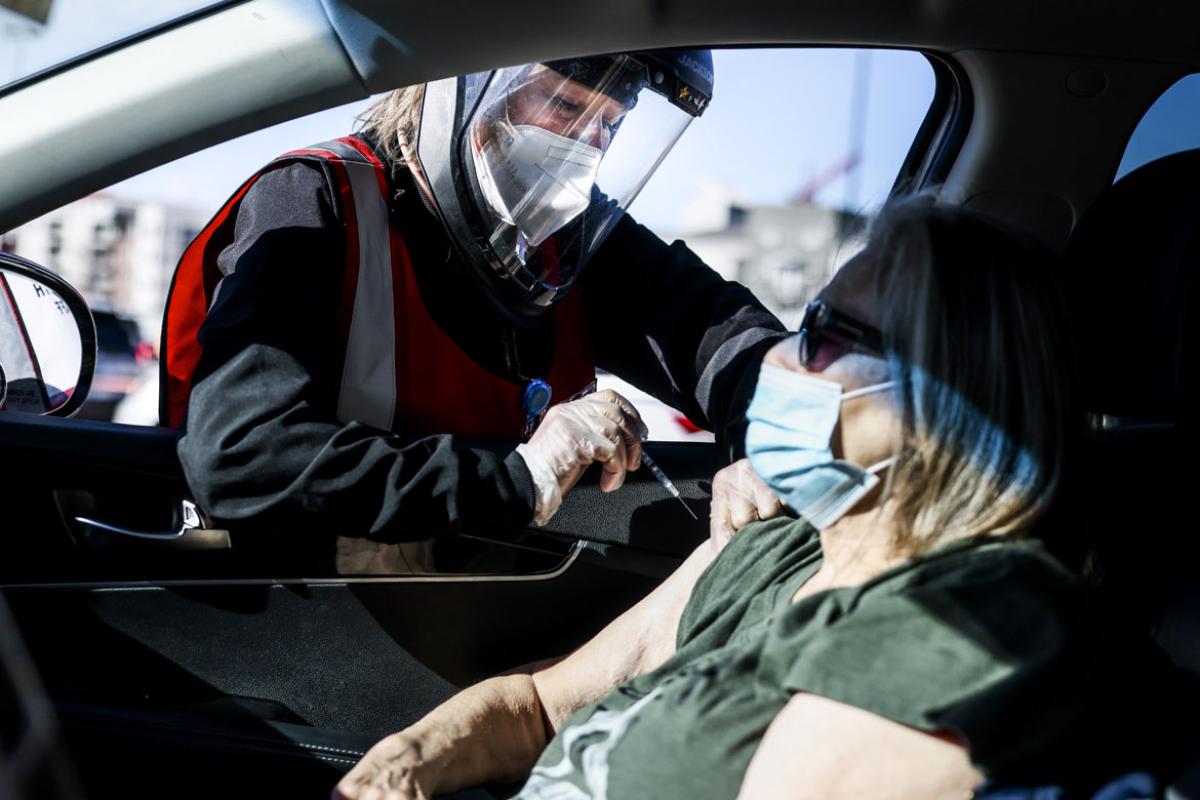 Person receiving the vaccine in her car