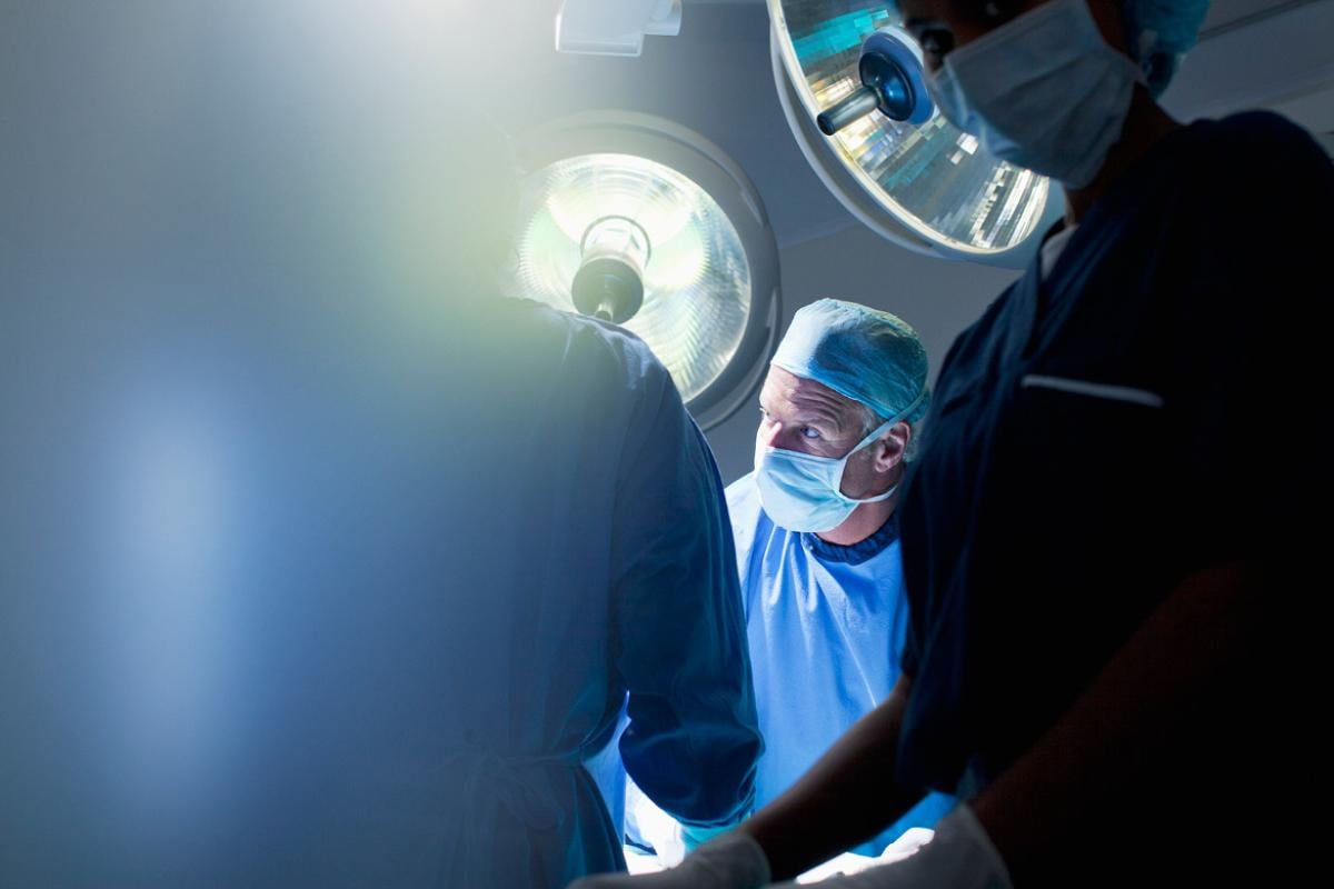 Health care workers in operating room