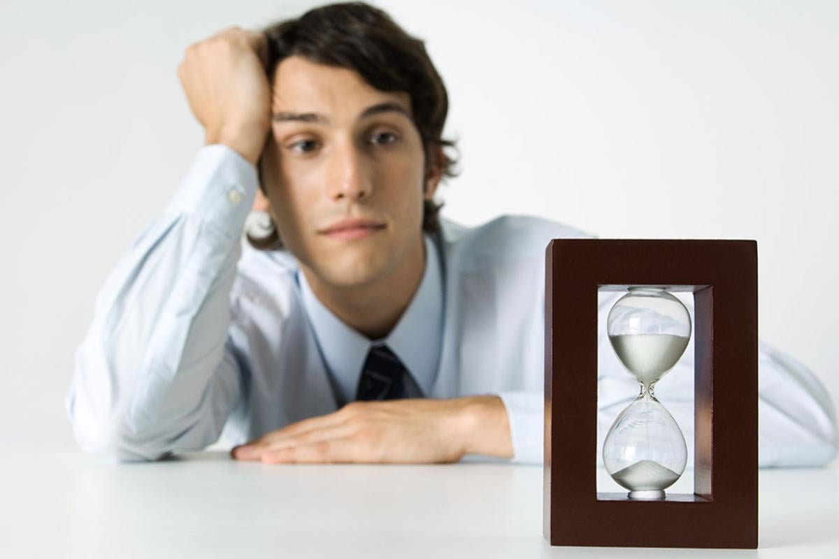 Person looking at hourglass