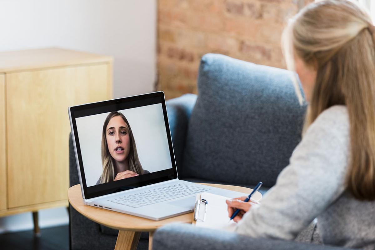 Two people meeting through a virtual appointment
