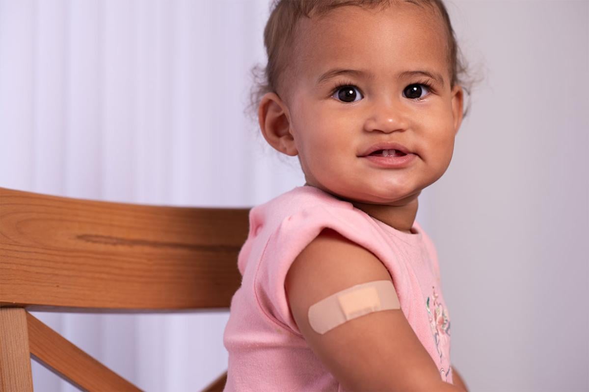  Young child with bandage on upper arm