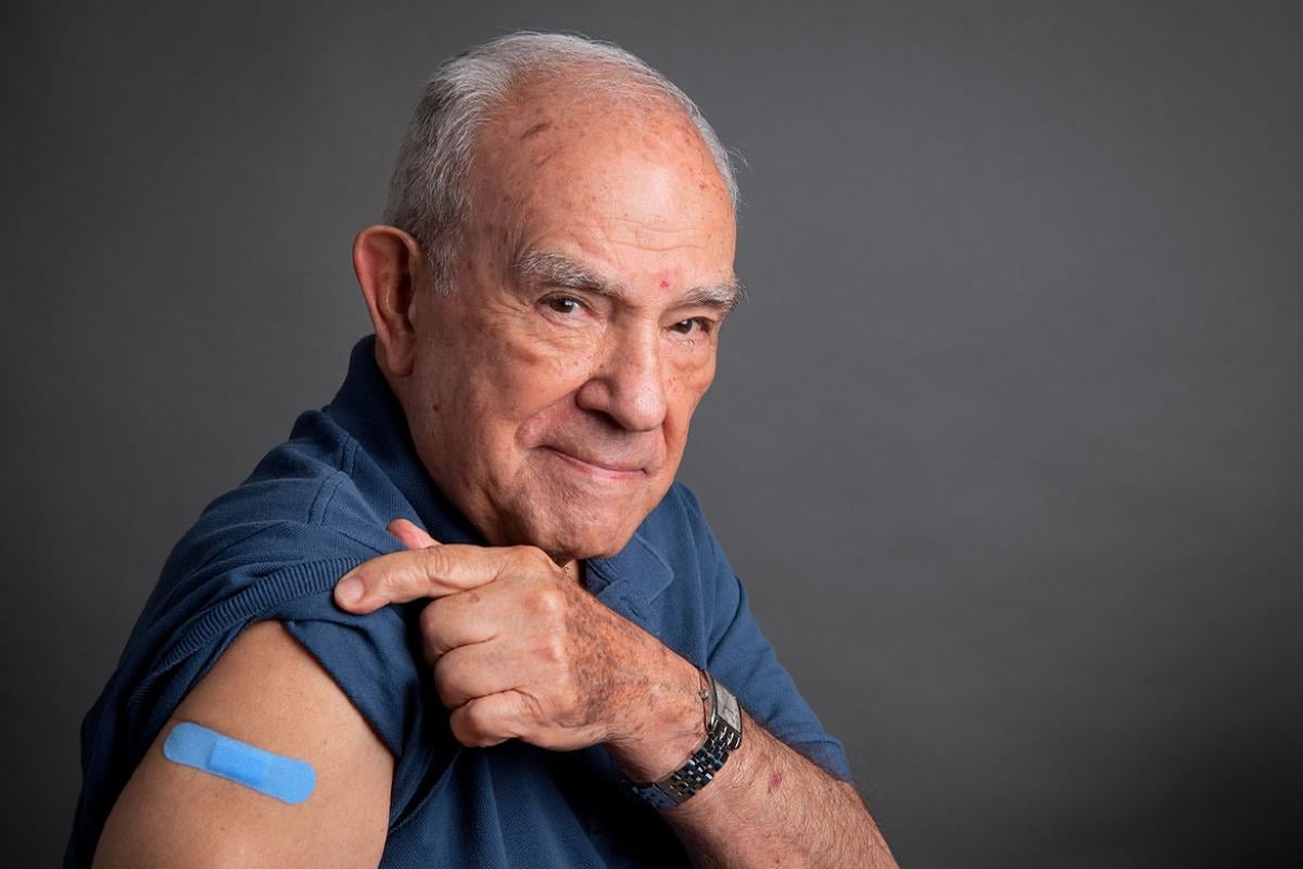 Senior patient with bandage over upper arm