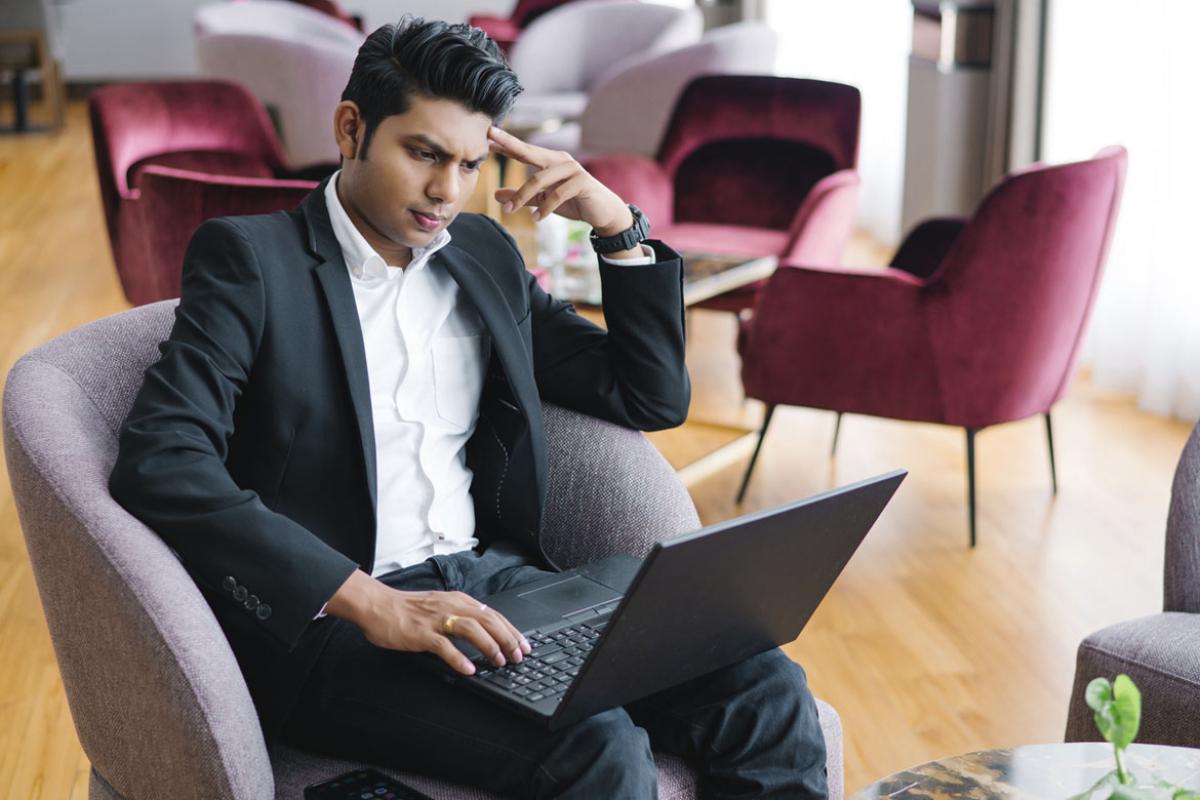 Focused businessperson working on a laptop