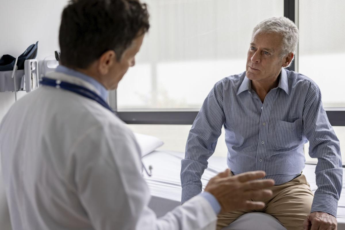 Patient intently listens to physician during an appointment