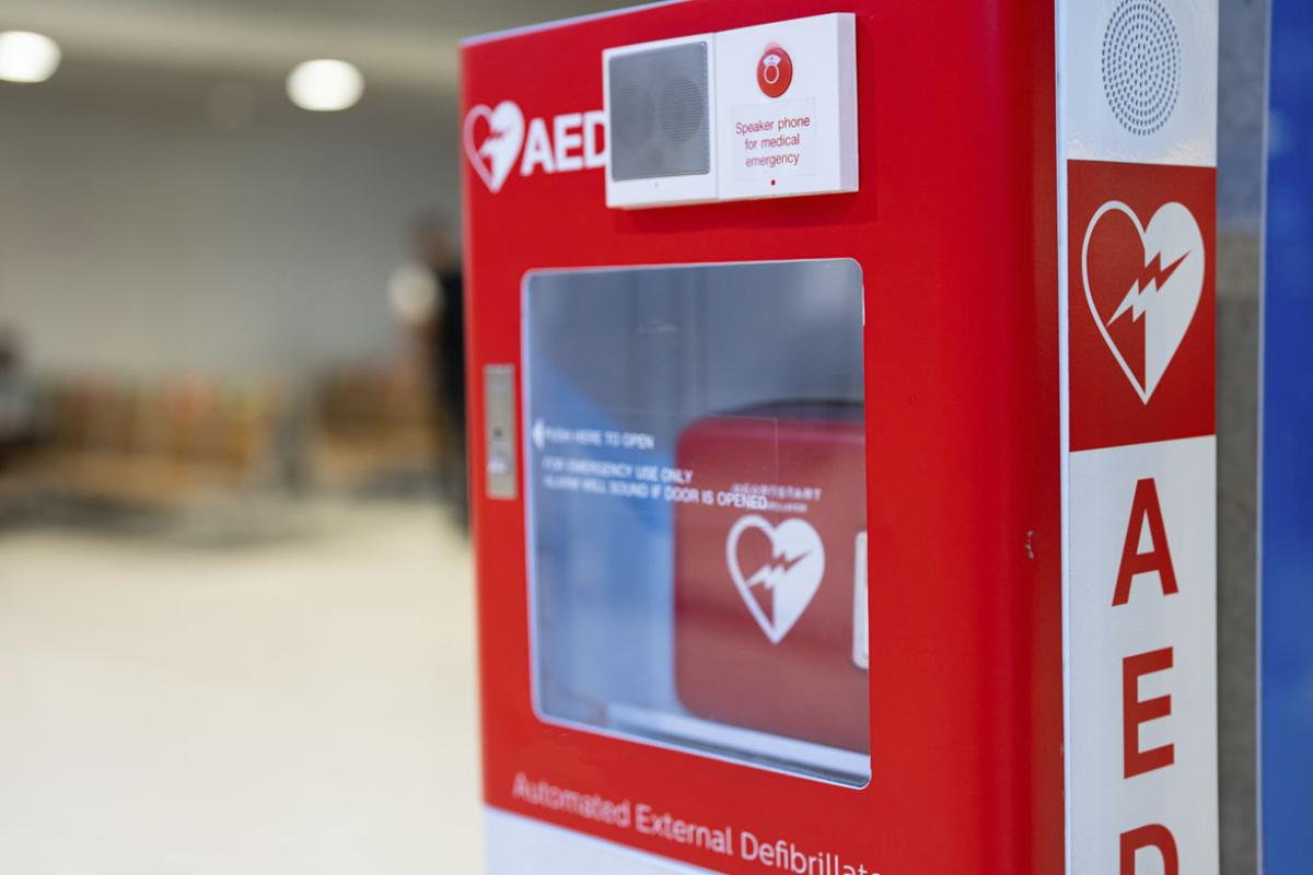 An Automated External Defibrillator, (AED) placed on the wall
