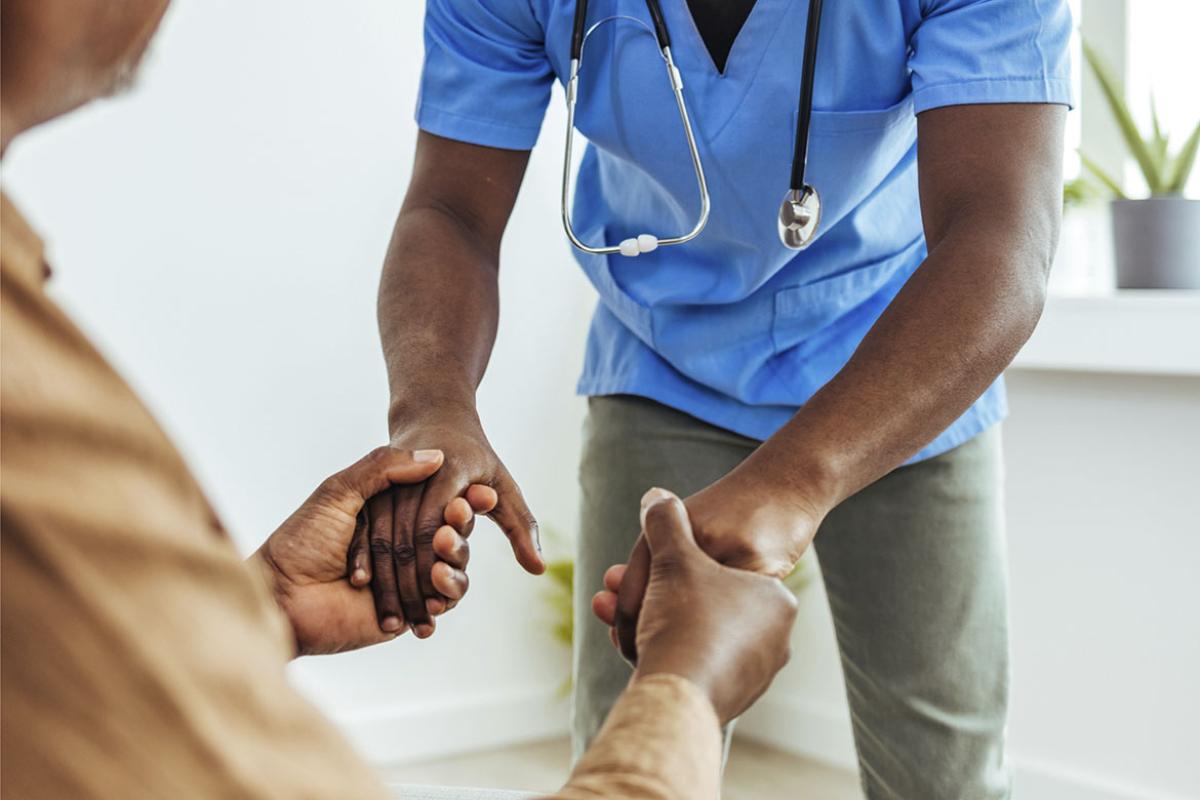 Caretaker assisting senior patient