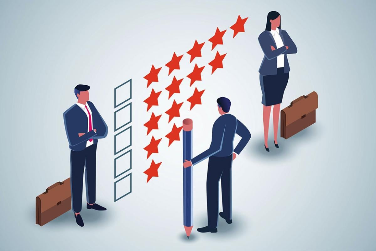 Businesspeople standing by a five-star rating