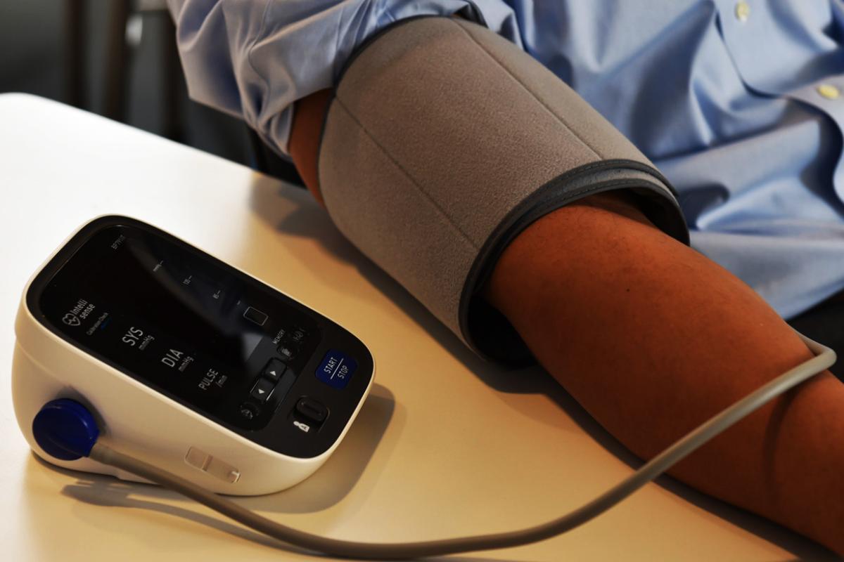 Machine takes patient's blood pressure.