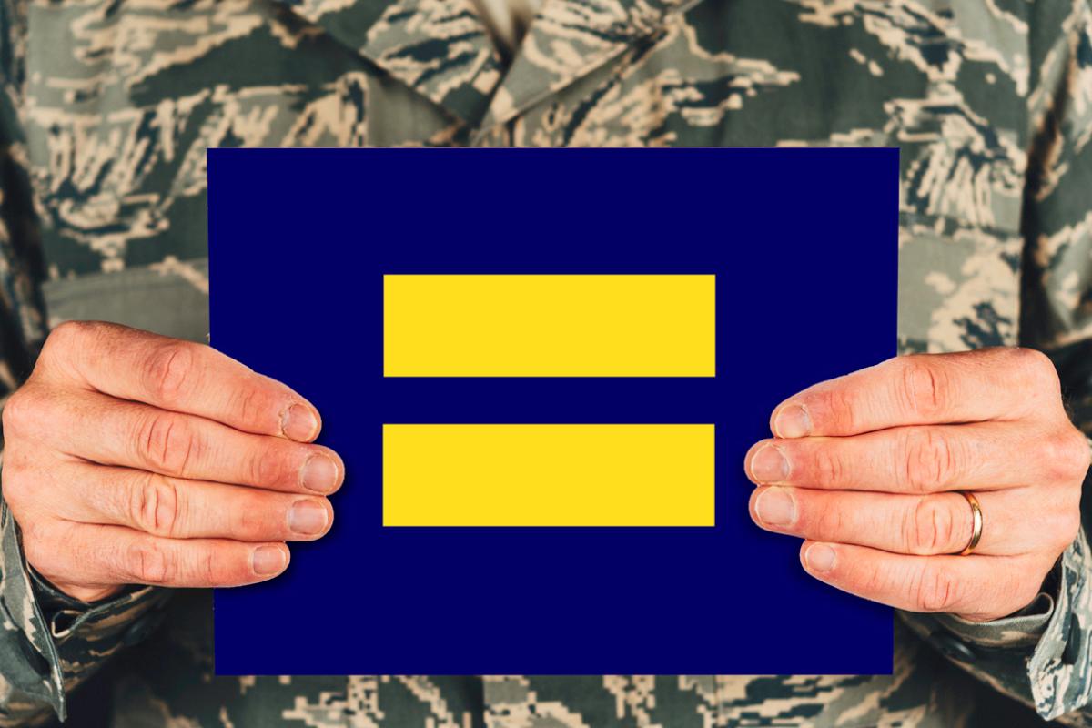 Equality logo held by soldier. 