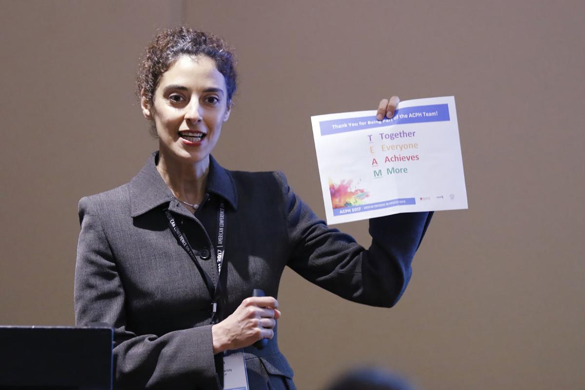 Maryam Hamidi, PhD, displaying a TEAM chart. 