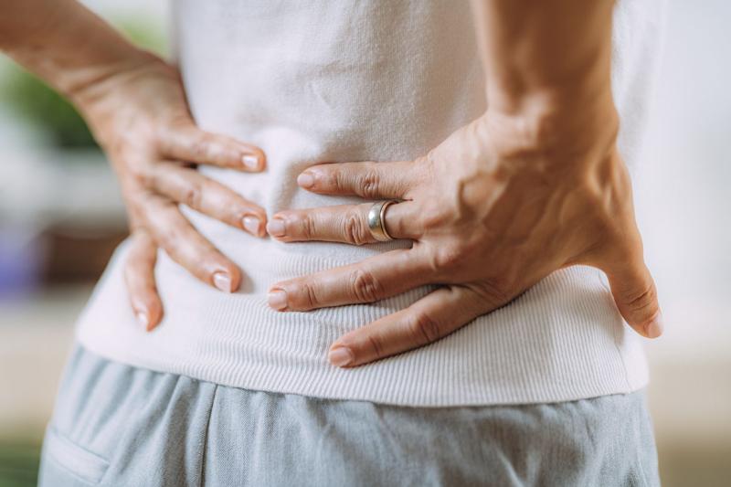 Hands on lower back